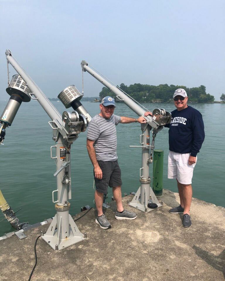 Happy Campers inspecting their Rotorflush Filterpumps on Lake Eyrie