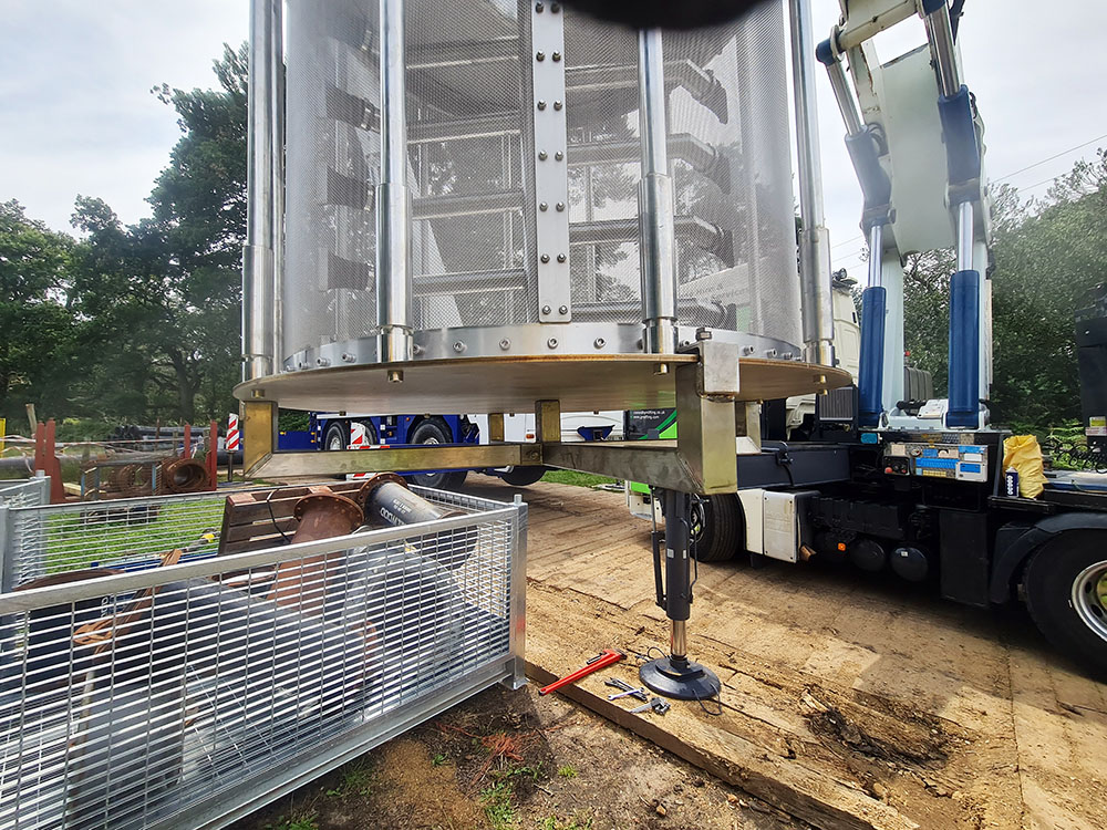 RF1100 filter being lowered into place